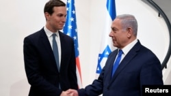 Israeli Prime Minister Benjamin Netanyahu, right, shakes hands with Senior White House advisor Jared Kushner during their meeting in Jerusalem May 30, 2019.