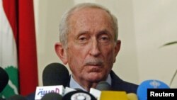 FILE - Lebanon's pro-Syrian Prime Minister Omar Karami speaks during a news conference moments before he announced his resignation in Beirut, April 2005.