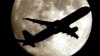 FILE- A jet plane approaching Los Angeles International Airport crosses the moon as seen from Palm Park in Whittier, California, Aug. 19, 2013.