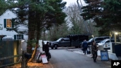 FILE - The access road to President Joe Biden's home in Wilmington, Delaware, is seen from the media van on Jan. 13, 2023.