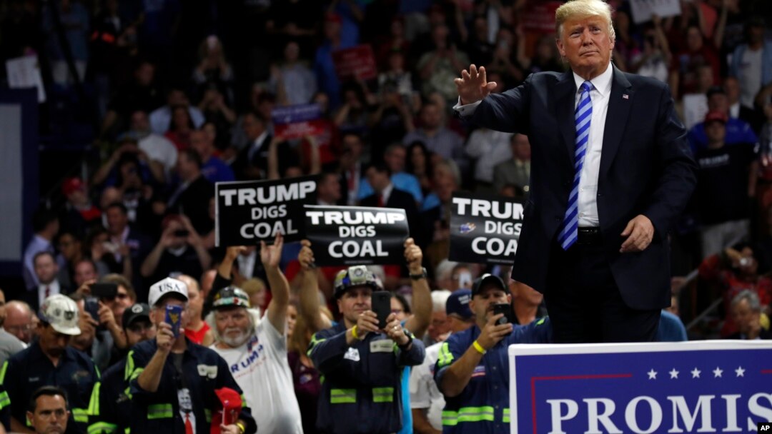 President Donald Trump waves after speaking during a rally, Aug. 21, 2018, in Charleston, West Virginia. 