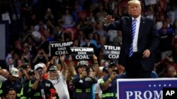 President Donald Trump waves after speaking during a rally, Aug. 21, 2018, in Charleston, West Virginia. 