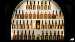 FILE - Bottles of bourbon are shown in a display case at the Heaven Hill Bourbon Heritage Center in Bardstown, Kentucky, April 8, 2009.