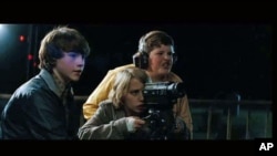 Middle schoolers filming a movie witness a train derailment that sets the plot of 'Super 8' into high gear, June 2011