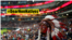 A fan of the Major League Baseball team Cleveland Indians wears a feathered headdress while watching the team's World Series game against the Chicago Cubs in Cleveland, Ohio, October 30, 2016, in what Native Americans regard as offensive cultural appropri