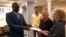 FILE - John Allen and Joyce Krajian, parents of the late Christopher Allen, meet with South Sudan’s ambassador, Phillip Jada Natana in Washington, Aug. 26, 2019. 