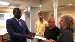 FILE- John Allen and Joyce Krajian, parents of the late Christopher Allen, meet with South Sudan’s Ambassador Phillip Jada Natana in Washington, Aug. 26, 2019. (A.Bior/VOA)