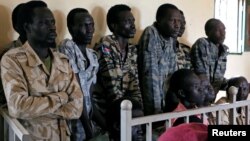 South Sudanese soldiers suspected of raping five foreign aid workers and killing their local colleague are seen before appearing in a military court in South Sudan's capital Juba, May 30, 2017. 