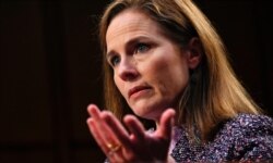 FILE - Supreme Court nominee Amy Coney Barrett testifies during the third day of her confirmation hearings before the Senate Judiciary Committee on Capitol Hill in Washington, Oct. 14, 2020.