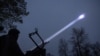 Vladyslav Tsukurov, judge and spokesperson of Bila Tserkva district court, observes the sky during a combat shift of his air defence volunteer unit, amid Russia's attack on Ukraine, in Kyiv region, Ukraine November 30, 2024.