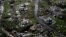 FILE - Destroyed communities are seen in the aftermath of Hurricane Maria in Toa Alta, Puerto Rico, Sept. 28, 2017. Puerto Rico's governor demanded action from U.S. Congress after announcing Feb. 27, 2018, that the Treasury Department has cut a nearly $5 