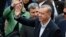Turkey’s President Recep Tayyip Erdogan waves to supporters after voting at a polling station in Istanbul, June 7, 2015.