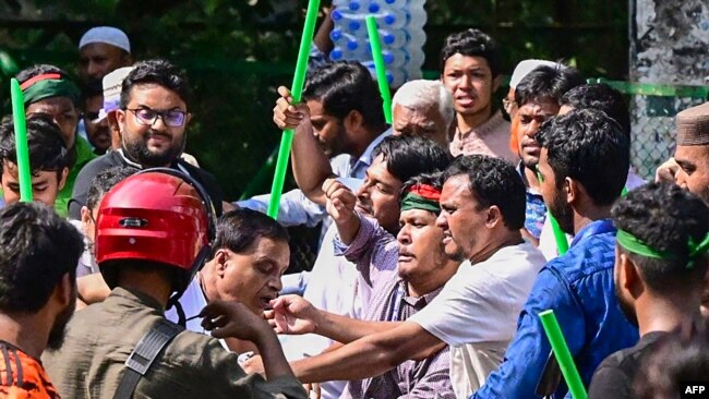Student protestors beat a suspected supporter of ousted Prime Minister Sheikh Hasina's Awami League party for paying respect to her parent and Bangladesh's founding father Sheikh Mujibur Rahman on his death anniversary, outside his residence in Dhaka on A
