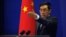 China's Foreign Ministry spokesman Liu Weimin gestures during a news conference in Beijing (file photo).