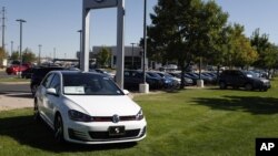 Volkswagens are on display on the lot of a VW dealership in Boulder, Colo., Sept. 24, 2015.