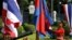 FILE PHOTO: A guard adjusts Cambodia's national flags before a welcoming ceremony at Government House in Bangkok, Thailand, on December 18, 2015. (REUTERS/Athit Perawongmetha)