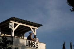 U.N Peacekeepers stand on a guard post in divided capital Nicosia, Cyprus, April 24, 2021.