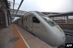 FILE - Nigeria's a new standard rail line, built by the China Civil Engineering Construction Corporation (CCECC), shuttles between the economic hub of Lagos and Ibadan, at the regional capital of southwest Nigeria at the Ebute-Metta Lagos Station, March 16, 2021.