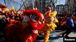 Dancers wearing lion costumes perform during the Lunar Chinese New Year of the Tiger cultural celebration in the Chinatown neighborhood of Manhattan in New York City, New York, U.S., February 1, 2022. REUTERS/Mike Segar