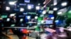 FILE - An anchor prepares to go on the air in a television studio in Moscow, Russia, June 8, 2018.
