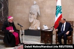 Lebanon's President Michel Aoun meets with the Vatican's foreign minister Archbishop Paul Gallagher at the presidential palace in Baabda, Lebanon, Feb. 1, 2022.