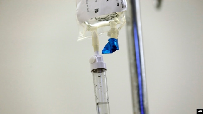 FILE - Chemotherapy drugs are administered to a cancer patient at a hospital in Chapel Hill, N.C., May 25, 2017.