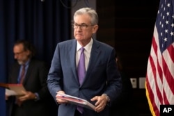 Federal Reserve Chairman Jerome Powell walks to the podium during a news conference in Washington, July 31, 2019.