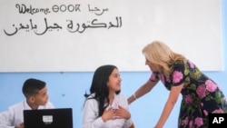 FILE - First Lady Jill Biden interacts with a student at Ibn Al Arif high school during her visit to Marrakech, Morocco, Monday, June 5, 2023. (AP Photo/Mosa'ab Elshamy, Pool, File)