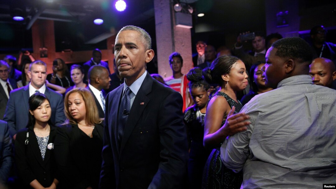 U.S. President Barack Obama meets members of the audience, including Cameron Sterling (R), son of Alton Sterling who was shot and killed by white police officers in Baton Rouge, after taking part in a televised town hall about trust and safety in our comm