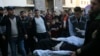 Palestinian medics move a wounded woman, who was shot by Israeli troops during a protest at the Gaza Strip's border with Israel, into the treatment room of Shifa hospital in Gaza City, Friday, Feb. 8, 2019.