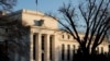 FILE - The Federal Reserve building is seen before the Federal Reserve board is expected to signal plans to raise interest rates in March as it focuses on fighting inflation in Washington, Jan. 26, 2022. 