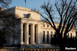 FILE - The Federal Reserve building is seen before the Federal Reserve board is expected to signal plans to raise interest rates, as it focuses on fighting inflation in Washington, Jan. 26, 2022.
