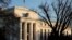 FILE - The Federal Reserve building is seen before the Federal Reserve board is expected to signal plans to raise interest rates in March as it focuses on fighting inflation in Washington, Jan. 26, 2022. 