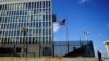 FILE - A security guard stands outside the U.S. Embassy in Havana, Cuba, Dec. 12, 2017.