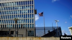 FILE - A security guard stands outside the U.S. Embassy in Havana, Cuba, Dec. 12, 2017.