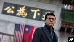 Kamaltürk Yalqun, an Olympic flame carrier for the 2008 Beijing Olympics, is pictured in Boston, Jan. 28, 2022. In later years, Beijing imposed policies in Xinjiang that split apart his family and the Uyghur community. Today, he's calling for a boycott of the 2022 Beijing Games.