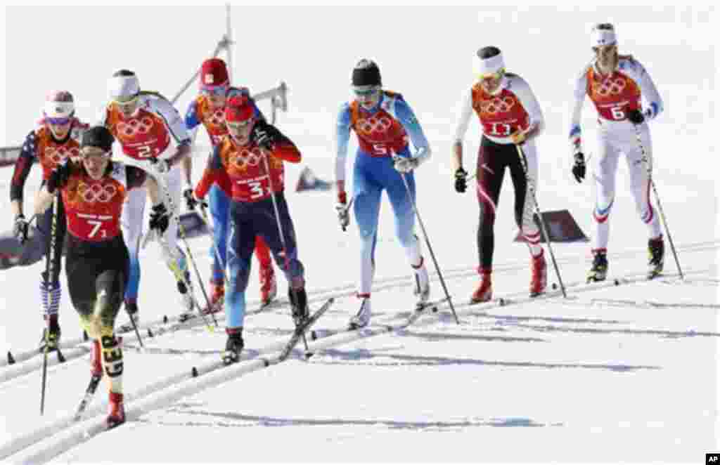United States' Kikkan Randall, Germany's Nicole Fessel, Sweden's Ida Ingemarsdotter Czech Republic's Eva Vrabcova-Nyvltova, Russia's Yulia Ivanova, Finland's Anne Kylloenen, Austria's Katerina Smutna and France's Aurore Jean, from left, ski during the wom