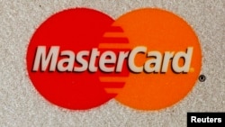 FILE - MasterCard and VISA credit cards are seen in this illustrative photograph taken in Hong Kong, Dec. 8, 2010.