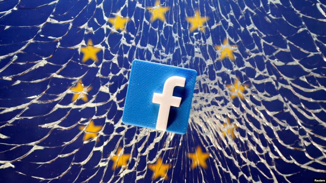 FILE - An illustration shows a 3-D-printed Facebook logo placed on broken glass above a printed EU flag.