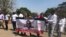 Doctors and nurses in Zimbabwe protest the disappearance of Peter Gabriel Magombeyi, acting president of the Zimbabwe Hospital Doctors Association, in Harare, Sept. 17, 2019. (C. Mavhunga/VOA)