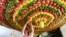 A woman from the Samaritan sect decorates a traditional hut known as a "sukkah", which is a ritual hut used during the Jewish holiday of Sukkot, with fruits and vegetables, on Mount Gerizim on the outskirts of the West Bank city of Nablus.
