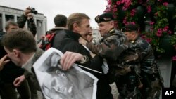 FILE - Belarusian police officers clash with protesters during an opposition rally in Minsk, Belarus, Sept. 16, 2008, marking the ninth anniversary of the disappearance of Belarusian politician Viktor Gonchar and businessman Anatoly Krasovsky.