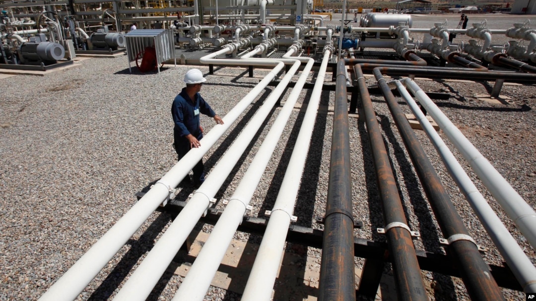 FILE - An employee works at the Tawke oil fields in the Kurdish region in northern Iraq, May 31, 2009.
