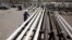 FILE - An employee works at the Tawke oil fields in the Kurdish region in northern Iraq, May 31, 2009.