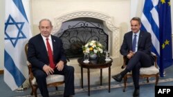 Greek Prime Minister Kyriakos Mitsotakis (R) meets Israeli Prime Minister Benjamin Netanyahu at the presidential palace in the Cypriot capital Nicosia on September 4, 2023.