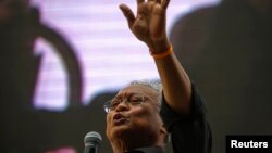 Protest leader Suthep Thaugsuban addresses anti-government protesters at their encampment in central Bangkok, Thailand, Feb. 28, 2014.