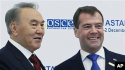 Russian President Dmitry Medvedev, right, and Kazakh President Nursultan Nazarbayev seen at the start of Organisation for Security and Cooperation in Europe meeting in Astana, Kazakhstan's capital, Dec. 1, 2010