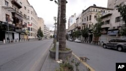 The streets of the Jordanian Capital are seen empty after the start of a nationwide curfew, amid concerns over the coronavirus pandemic, in Amman, Jordan, March 21, 2020. 