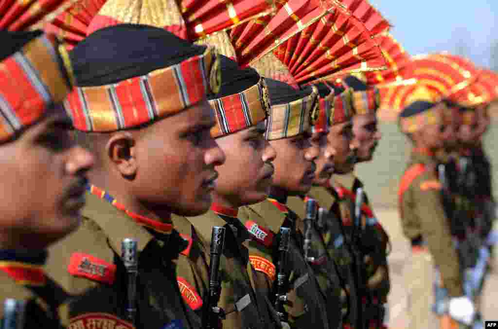 Indian Border Security Force (BSF) soldiers participate in a parade in Humhama, on the outskirts of Srinagar. Some 333 trained constable recruits were formally inducted into the BSF after completing 44 weeks of training.