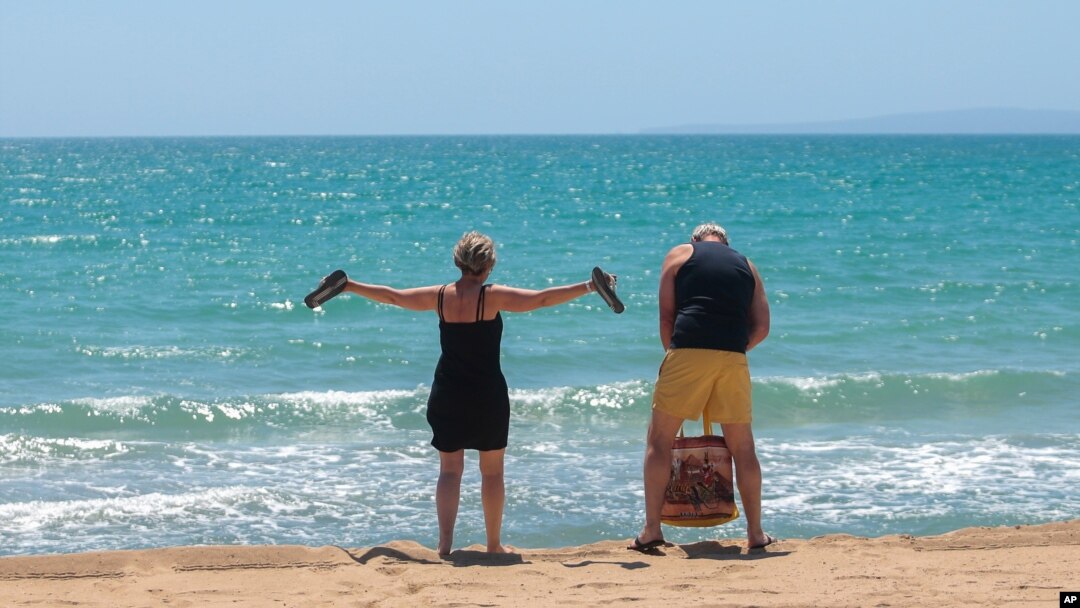 German tourists arrive at the beach of Palma de Mallorca, Spain, June 15, 2020.